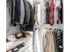 Organized closet with hanging clothes, folded items, and shelves with shoes at 12640 Hearthstone Way, Alpharetta, GA 30009