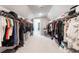 Spacious walk-in closet featuring hanging racks, shelving, and organization for ample storage at 12640 Hearthstone Way, Alpharetta, GA 30009