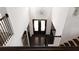 Grand foyer showcases a chandelier and staircase, welcoming visitors into this bright and inviting space at 12640 Hearthstone Way, Alpharetta, GA 30009