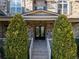 Charming front porch entrance with stone stairway and brick walkway leads to beautiful home at 12640 Hearthstone Way, Alpharetta, GA 30009