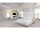 Bright and airy main bedroom with tray ceiling, fireplace, seating area, and elegant decor at 12640 Hearthstone Way, Alpharetta, GA 30009