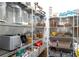 Organized walk-in pantry featuring ample shelving and storage for food items and kitchen appliances at 12640 Hearthstone Way, Alpharetta, GA 30009