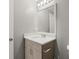 Bathroom featuring a vanity with a mirror and a sink at 241 Odyssey Turn Nw, Conyers, GA 30012