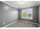 This bedroom has a large window that provides plenty of natural light at 241 Odyssey Turn Nw, Conyers, GA 30012