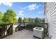 This deck has a wood railing and an air conditioning unit at 241 Odyssey Turn Nw, Conyers, GA 30012