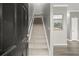 View of the entryway with the staircase and the open floor plan of the home at 241 Odyssey Turn Nw, Conyers, GA 30012