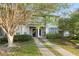 Charming townhome exterior with well-manicured lawn and convenient parking spaces at 241 Odyssey Turn Nw, Conyers, GA 30012