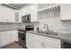 Beautiful kitchen featuring stainless steel appliances, sleek countertops, and ample cabinetry at 241 Odyssey Turn Nw, Conyers, GA 30012