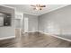 This living room has hardwood flooring and neutral paint color at 241 Odyssey Turn Nw, Conyers, GA 30012