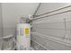 Utility room with hot water tank and plenty of shelving at 241 Odyssey Turn Nw, Conyers, GA 30012