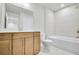 Well-lit bathroom with modern vanity, toilet, and bathtub shower combo at 5761 Tillman Way, Powder Springs, GA 30127