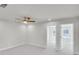 Bedroom with neutral carpet, ceiling fan and natural light with a doorway to an adjoining room at 5761 Tillman Way, Powder Springs, GA 30127