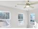Bright bedroom features natural light from three windows at 5761 Tillman Way, Powder Springs, GA 30127