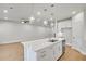 Open concept kitchen with island, hardwood floors, recessed lighting, and stainless steel appliances at 5761 Tillman Way, Powder Springs, GA 30127