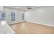Hardwood flooring, recessed lighting and large windows illuminate the space in the modern living area at 5761 Tillman Way, Powder Springs, GA 30127