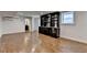 Finished basement featuring a wet bar, hardwood floors and a bathroom at 7160 Round Rd, Cumming, GA 30040