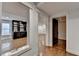 Open basement with bar area, hardwood floors, and recessed lighting at 7160 Round Rd, Cumming, GA 30040