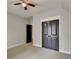 Bedroom with double doors to closet and connecting door to another room at 7160 Round Rd, Cumming, GA 30040