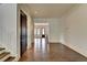 Open hallway with hardwood floors, white walls, and decorative trim at 7160 Round Rd, Cumming, GA 30040