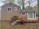 Backyard with a patio, steps, and blossoming azalea bushes at 883 Greenhedge Dr, Stone Mountain, GA 30088