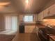 Well-lit kitchen with black appliances, tile backsplash, and tile flooring at 883 Greenhedge Dr, Stone Mountain, GA 30088