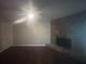Cozy living room with hardwood floors, stone fireplace, and ample space at 883 Greenhedge Dr, Stone Mountain, GA 30088
