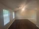 Bright living room featuring wood flooring, natural light, and vaulted ceilings at 883 Greenhedge Dr, Stone Mountain, GA 30088