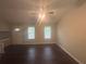 Open living space with wood floors, lots of natural light, and front door access at 883 Greenhedge Dr, Stone Mountain, GA 30088