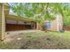 Backyard featuring a covered patio and partial fence at 9912 Mancunian Way, Douglasville, GA 30135