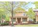 Charming two-story home with a welcoming front porch and manicured lawn at 9912 Mancunian Way, Douglasville, GA 30135