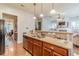 Kitchen featuring granite countertops, stainless steel appliances and views of the living room at 9912 Mancunian Way, Douglasville, GA 30135