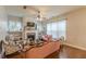 Comfortable living room featuring a fireplace, ceiling fan, and hardwood flooring at 9912 Mancunian Way, Douglasville, GA 30135