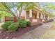 Charming side view of home with a manicured lawn at 9912 Mancunian Way, Douglasville, GA 30135