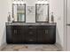 Bathroom features a double vanity with granite countertop, framed mirrors, and dark cabinetry at 1200 Virginia Ct # 101, Atlanta, GA 30306
