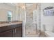 Bathroom features a glass shower, dark cabinets, granite countertops, and modern fixtures at 1200 Virginia Ct # 101, Atlanta, GA 30306