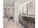 Modern bathroom features a glass shower, wooden accents, and double vanity with dark cabinets at 1200 Virginia Ct # 101, Atlanta, GA 30306