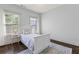 Bright bedroom featuring hardwood floors, neutral paint, and multiple windows at 1200 Virginia Ct # 101, Atlanta, GA 30306