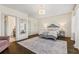 Bedroom with large windows, hardwood floors, and access to the ensuite bathroom at 1200 Virginia Ct # 101, Atlanta, GA 30306