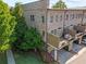 Charming brick townhome featuring a private balcony and a well-maintained lawn at 1200 Virginia Ct # 101, Atlanta, GA 30306