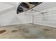 Spacious garage featuring a high ceiling, canoe, and a garage door at 1200 Virginia Ct # 101, Atlanta, GA 30306