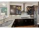 Modern kitchen with granite countertops, stainless steel appliances, and dark wood cabinets at 1200 Virginia Ct # 101, Atlanta, GA 30306