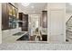 Modern kitchen with granite countertops, stainless steel appliances, and a view into the dining area at 1200 Virginia Ct # 101, Atlanta, GA 30306