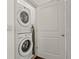 Compact laundry closet features stacked washer and dryer units for space-saving convenience at 1200 Virginia Ct # 101, Atlanta, GA 30306