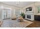 Bright living room features a fireplace, hardwood floors, and modern decor throughout the living space at 1200 Virginia Ct # 101, Atlanta, GA 30306
