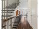 Elegant staircase with wrought iron railings and hardwood steps leading to the upper level at 1200 Virginia Ct # 101, Atlanta, GA 30306