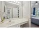 Bathroom with a wide vanity, large mirror, and view to a bedroom at 1228 Dunwoody Walk, Atlanta, GA 30338