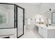 Bright bathroom featuring a corner glass shower, double sinks, and modern fixtures at 1228 Dunwoody Walk, Atlanta, GA 30338