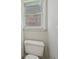 Cozy bathroom featuring a toilet and a window at 1228 Dunwoody Walk, Atlanta, GA 30338