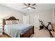 Bedroom featuring a king bed, ceiling fan, exercise bike, and hardwood floors, providing comfort and functionality at 1228 Dunwoody Walk, Atlanta, GA 30338