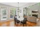 Cozy dining room with hardwood floors, modern lighting, and access to the outdoors, perfect for Gathering meals and gatherings at 1228 Dunwoody Walk, Atlanta, GA 30338